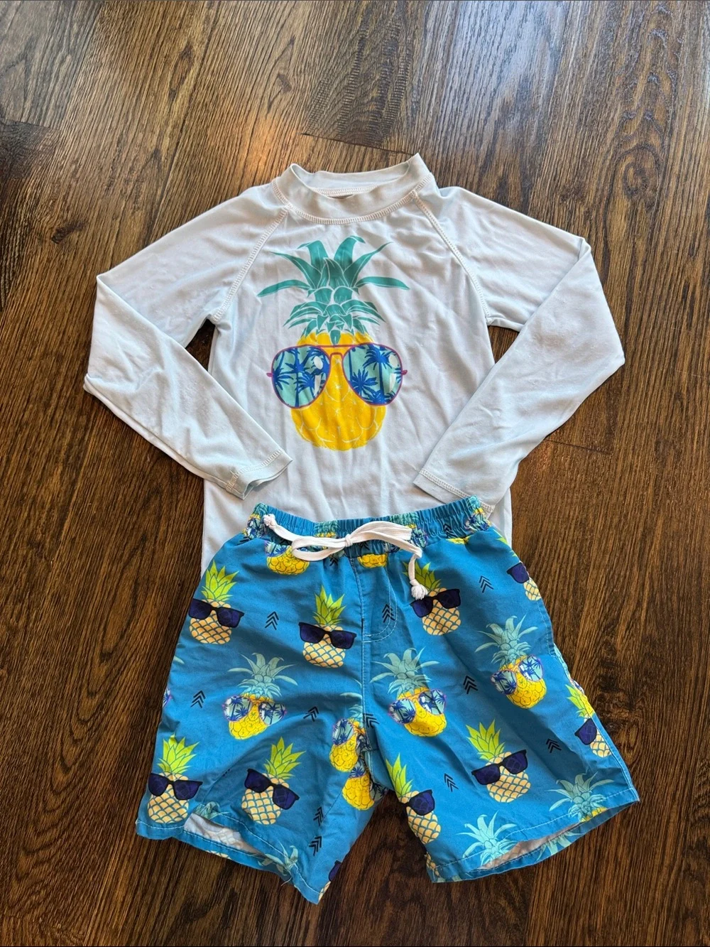 Pineapple swim trunks and rashguard